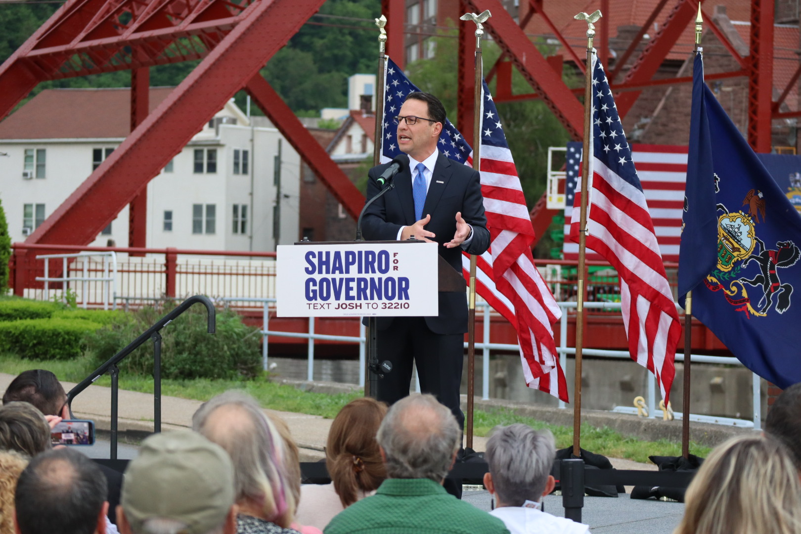 Josh gives a speech at a podium