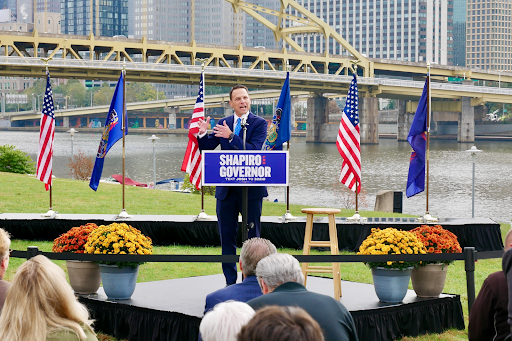 Josh standing at a podium.