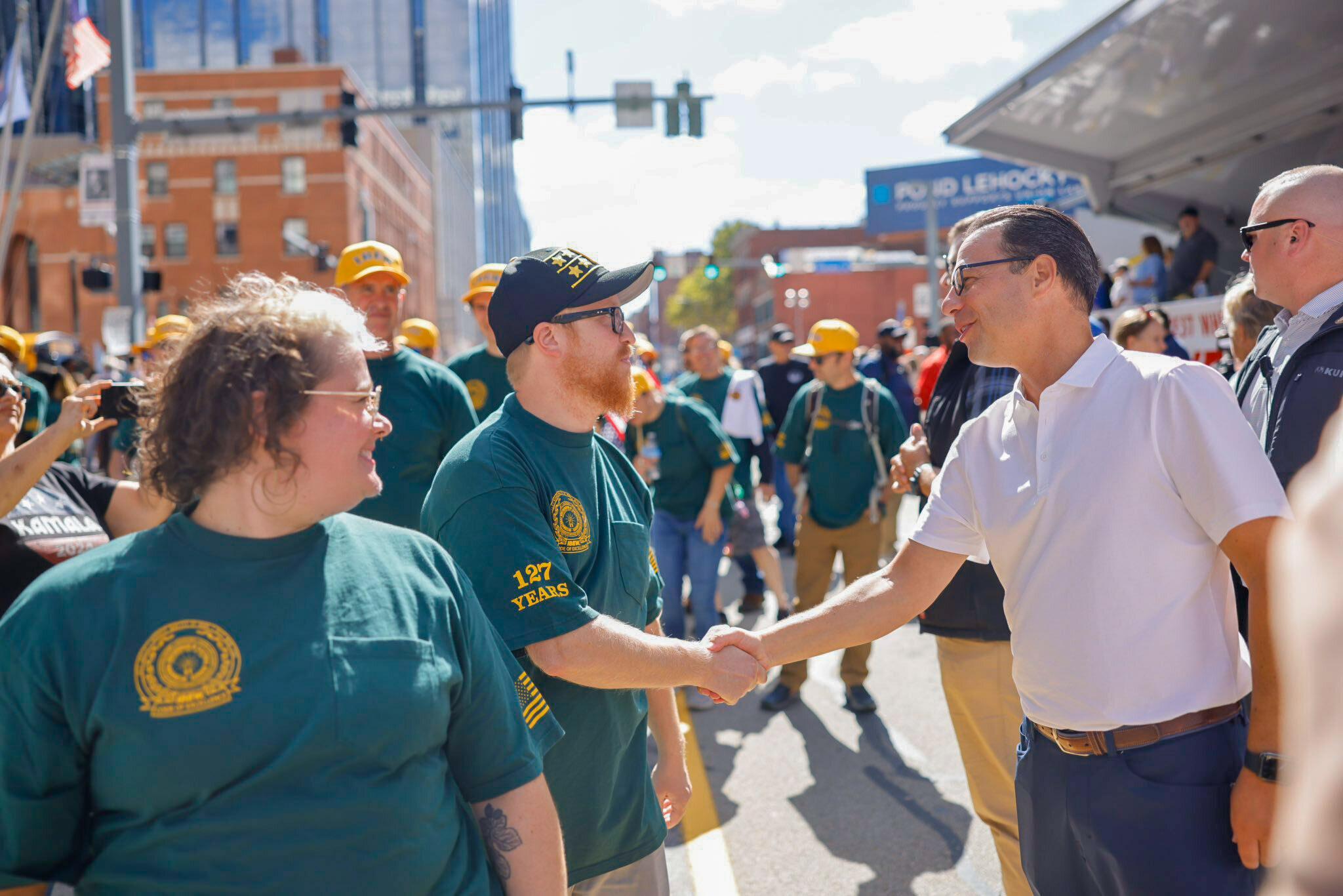 Shapiro shaking hands with teamster